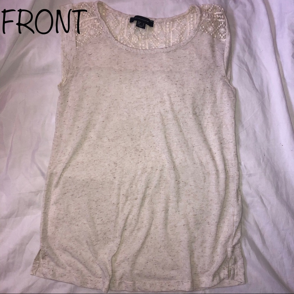 Cream colored sleeveless shirt